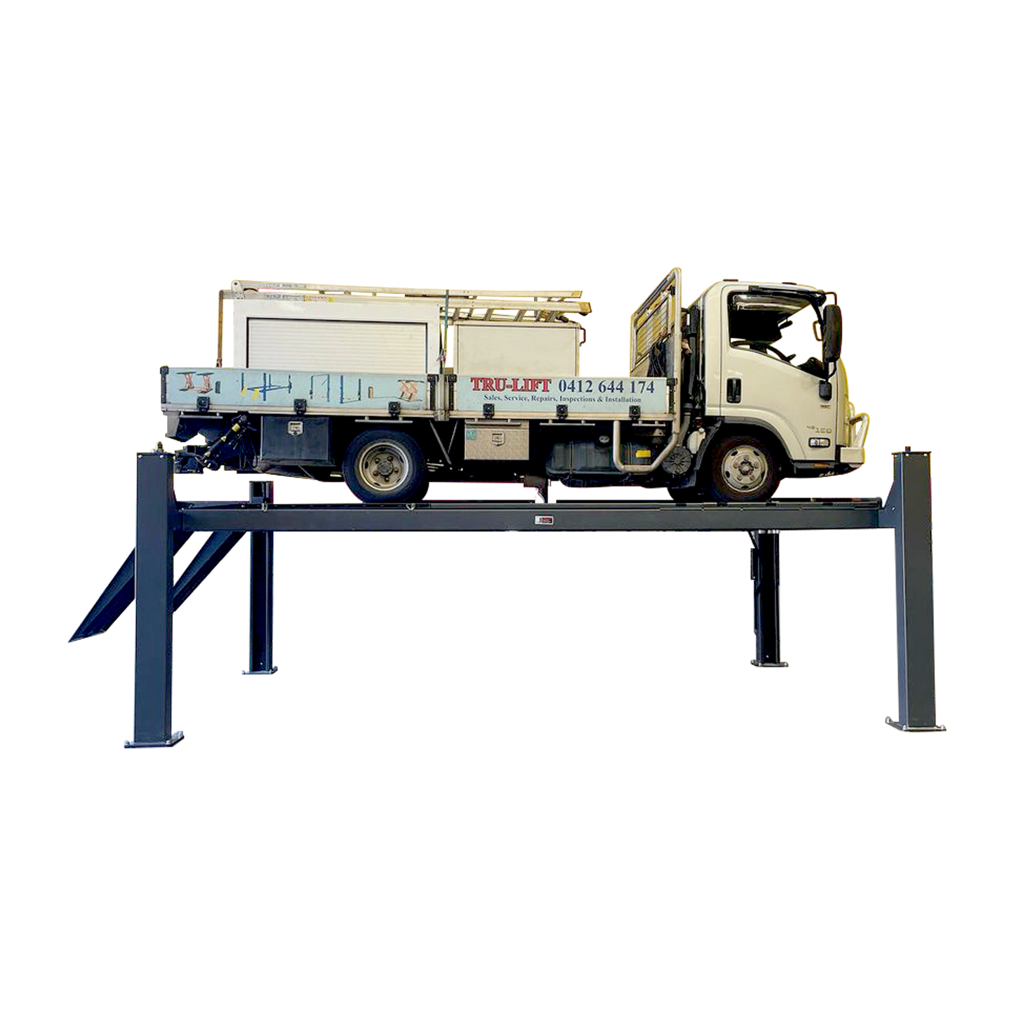 A heavy truck elevated on a four-post, eight ton workshop car hoist in a workshop setting. - 4 Post Hoist - 8.0 Ton | TLD8.0WH