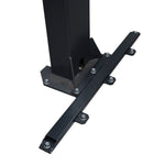 A close-up of a black column support bracket with multiple secured bolts, attached to a vertical column on a marbled floor, providing reinforcement for structural stability - EAE Column Support Kit