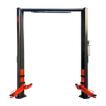 An unoccupied 2 post clear floor car hoist with charcoal grey posts and orange arms on a transparent background. - 2 Post Clear Floor - 5 Ton | EE-6215EKZ