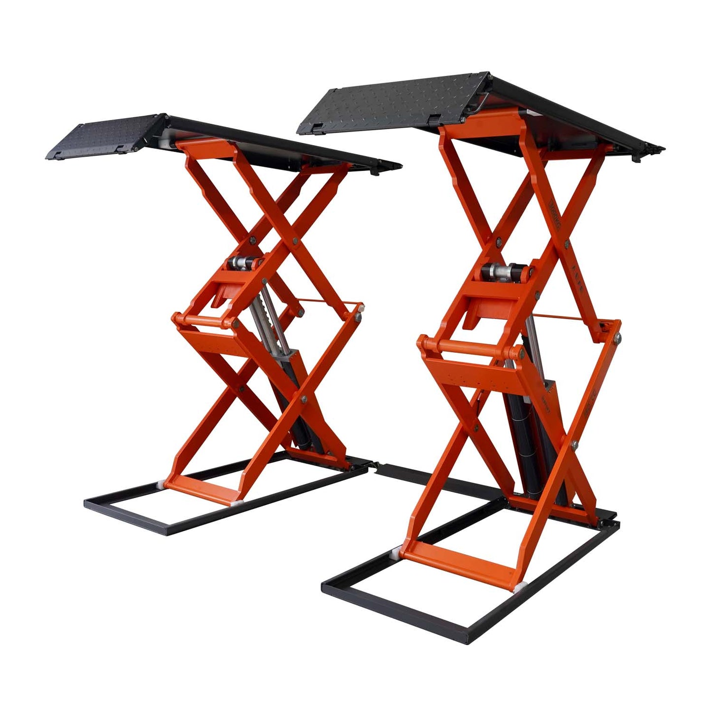 An orange scissor lift in a workshop, designed for lifting vehicles for maintenance and repairs.