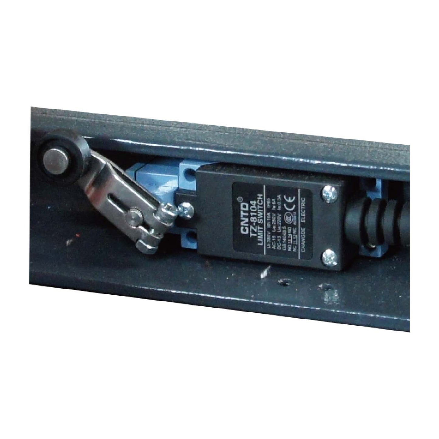 Close-up of a limit switch on a scissor lift, designed to control the maximum height and ensure safe operation.
