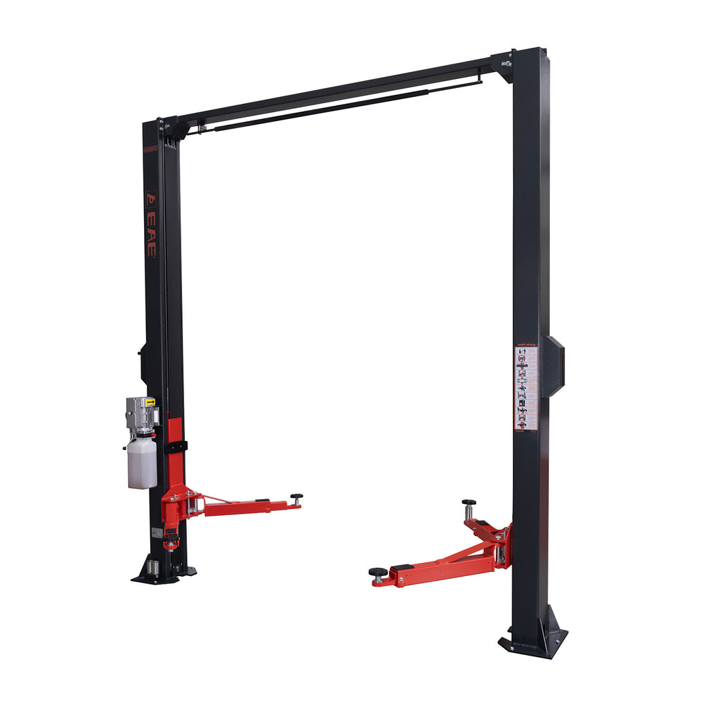 2-post car hoist by Tufflift Hoists with orange arms, grey posts, a visible hydraulic system, and adjustable low-profile arms for versatile vehicle lifting. - 2 Post Clear Floor Hoist - 4.5 Ton | EE-C10V2