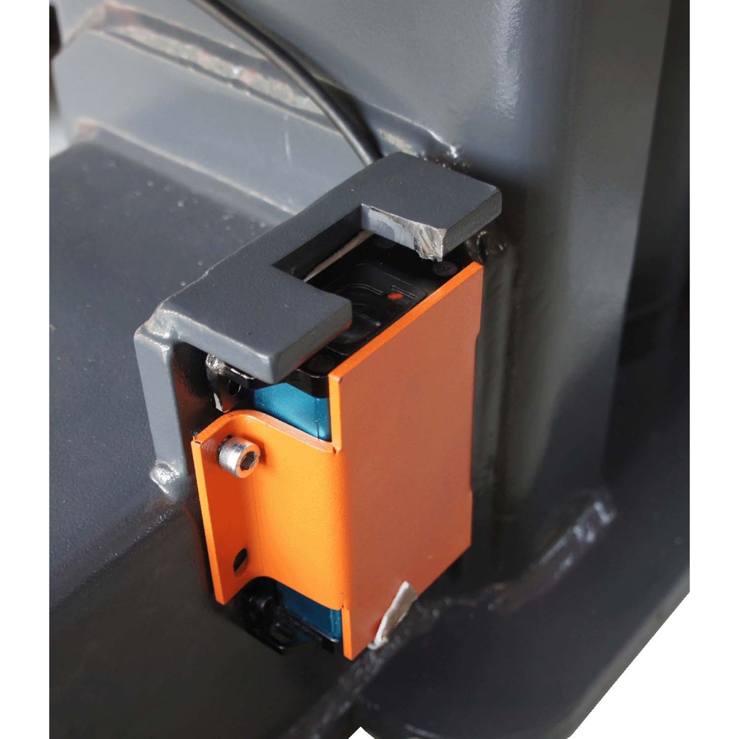 Close-up of a sensor or component on a mobile column lift, highlighting the intricate parts that ensure precise operation and safety.