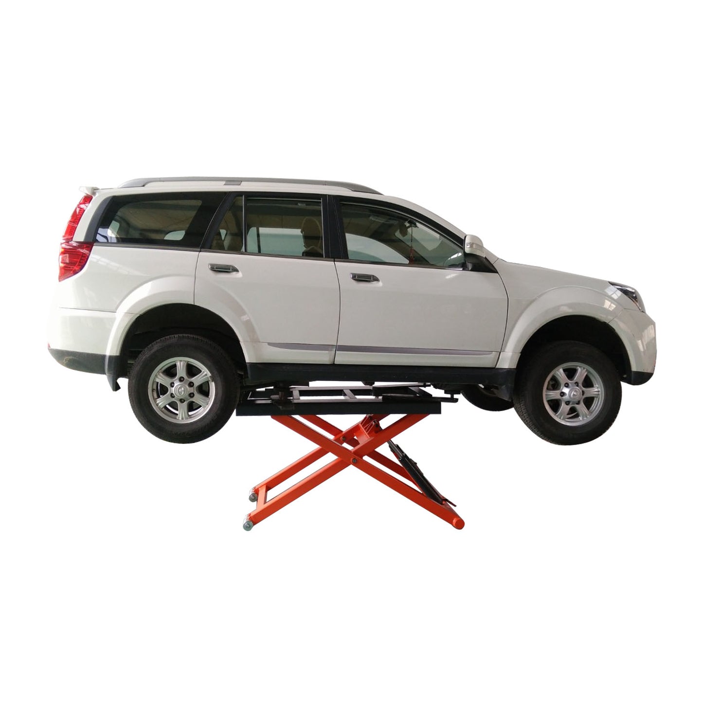 A white SUV elevated on an orange EAE hydraulic scissor lift platform. The platform is positioned under the vehicle, with all four wheels off the ground
