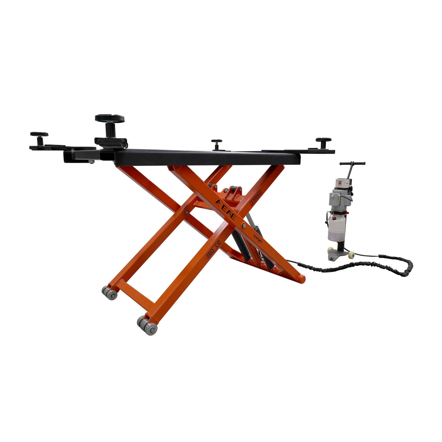 An orange EAE hydraulic scissor lift elevated at full height. The control unit and wiring are visible nearby, showcasing its compact design for vehicle maintenance.