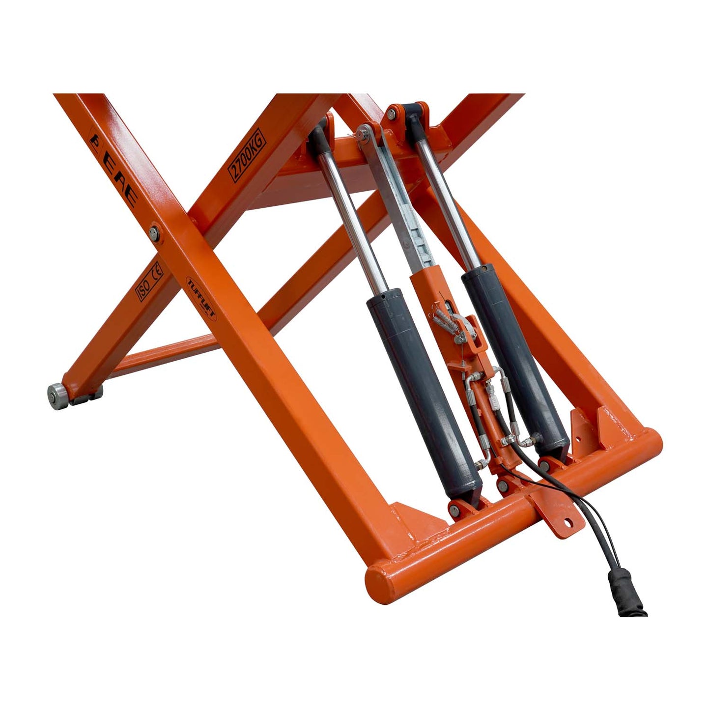 A close-up view of the hydraulic cylinders and mechanisms of an orange EAE scissor lift, model TS6600. The lift's support structure, labeled with a 2700kg capacity, is visible along with connected hydraulic lines and pistons.