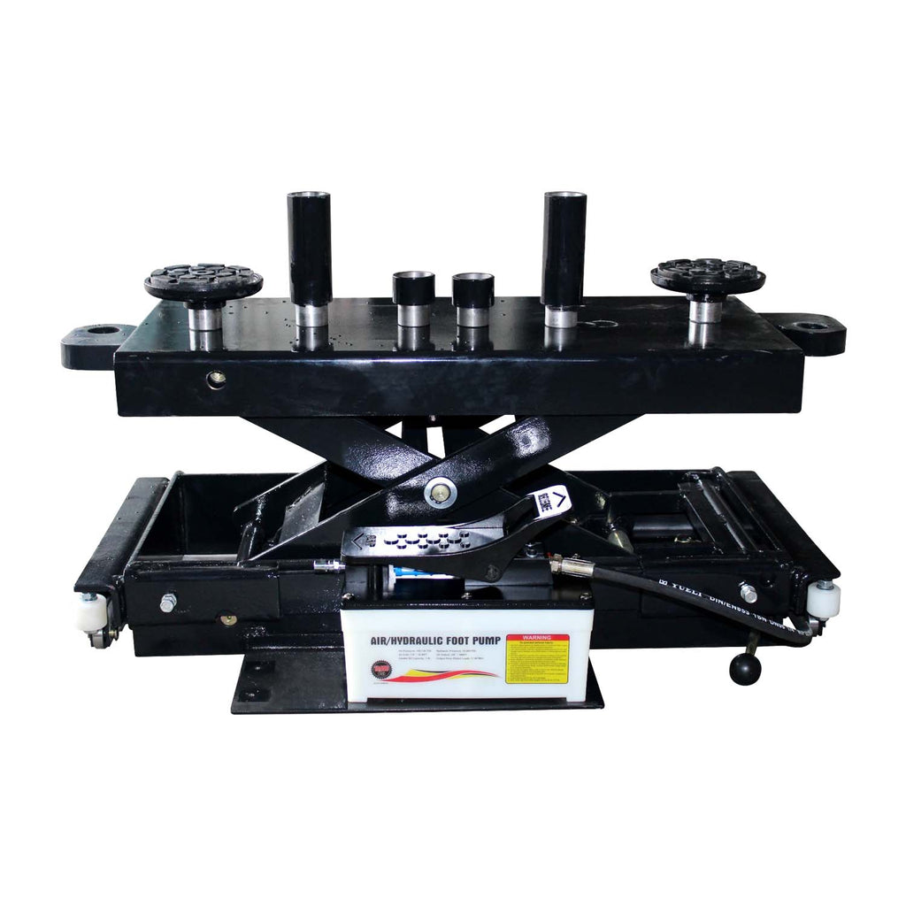 A black air pump rolling jack with a set of adapters and pads.