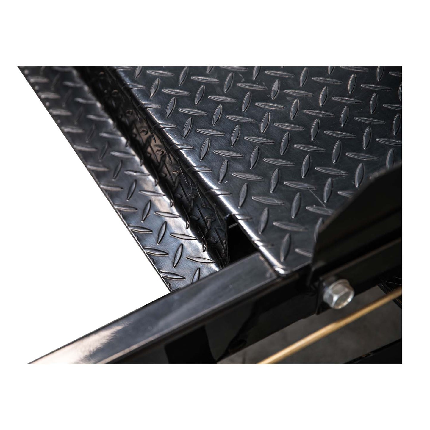 Detailed close-up of the TL3.6PH 4 post hoist’s diamond-plated surface, showcasing its durable, non-slip texture designed to ensure secure vehicle placement.