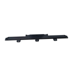 Long, horizontal black column support kit resting on a concrete floor, featuring evenly spaced holes for bolts, designed for stability in structural applications. - EAE Column Support Kit
