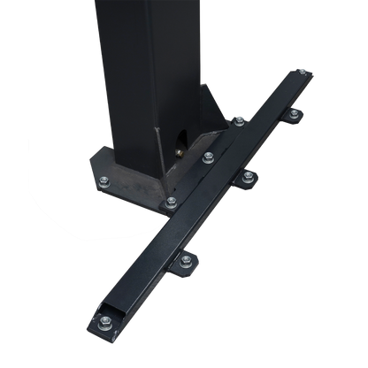 A close-up of a black column support bracket with multiple secured bolts, attached to a vertical column on a marbled floor, providing reinforcement for structural stability - EAE Column Support Kit