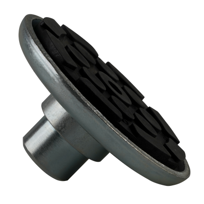 A drop-in rubber pad with a textured black surface and a metal base, designed for vehicle lifting setups. 