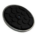 A top-down view of a rubber pad with a textured black surface, set within a metal frame.