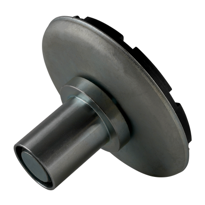 A drop-in screw pad viewed from a tilted angle, highlighting its metallic cylindrical base and wide circular support plate with a black textured rubber top.