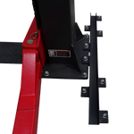 A heavy-duty column support kit, featuring a black steel bracket with multiple bolts, connected to a red baseplate and a vertical black column, complete with a warning label for safe operation. - Column Support Kit