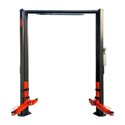 An unoccupied 2 post clear floor car hoist with charcoal grey posts and orange arms on a transparent background. - 2 Post Clear Floor - 5 Ton | EE-6215EKZ