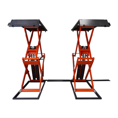 Front view of an orange scissor lifts in a workshop, designed for vehicle maintenance and lifting.