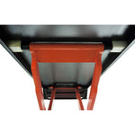 Close-up view of the underside of a scissor lift platform, showing the sturdy orange frame and support structure