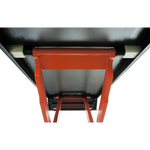 Close-up view of the underside of a scissor lift platform, showing the sturdy orange frame and support structure