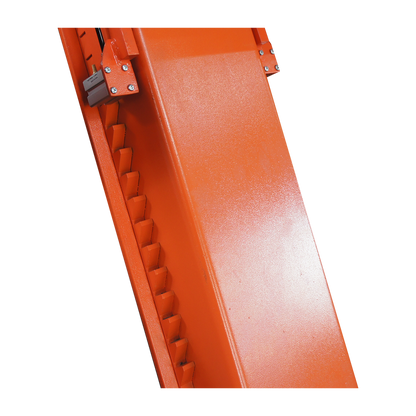 Close-up of the orange locking mechanism on a scissor lift, featuring a notched design for securing the lift at various heights. 