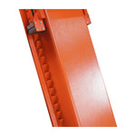 Close-up of the orange locking mechanism on a scissor lift, featuring a notched design for securing the lift at various heights. 