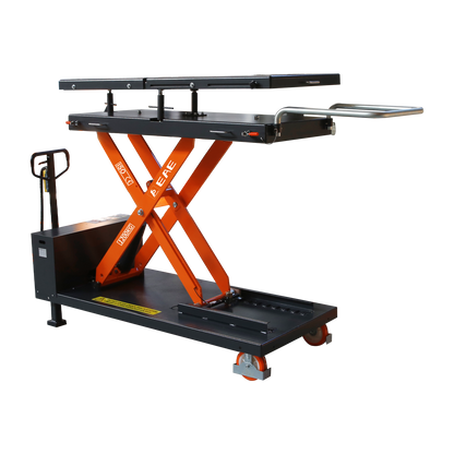 Scissor lift table with orange supports and black platform, designed for lifting and transporting heavy loads in a workshop