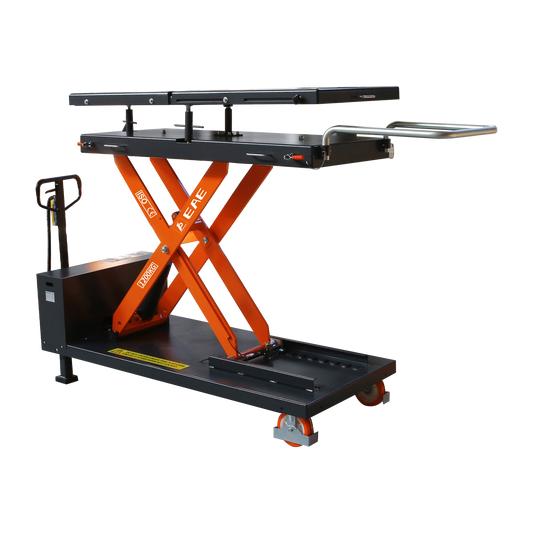 Scissor lift table with orange supports and black platform, designed for lifting and transporting heavy loads in a workshop