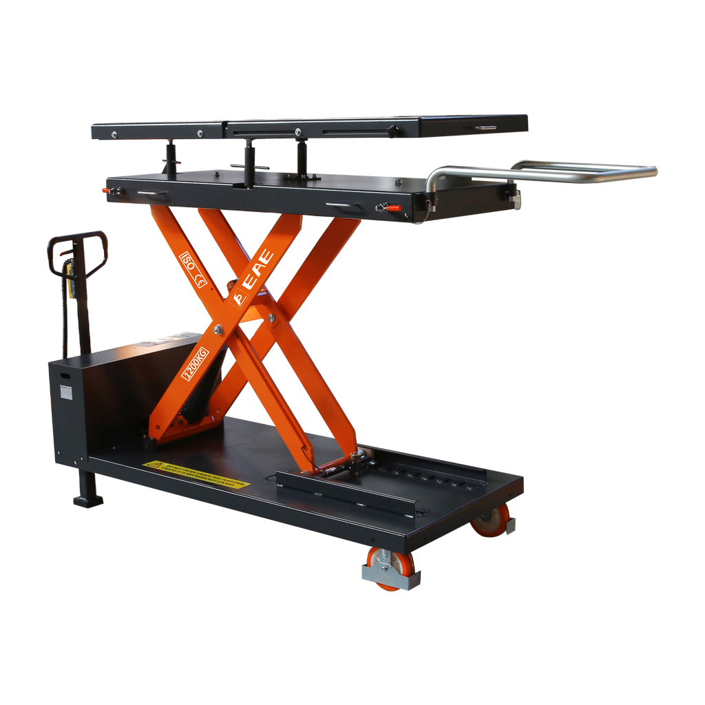 Scissor lift table with orange supports and black platform, designed for lifting and transporting heavy loads in a workshop