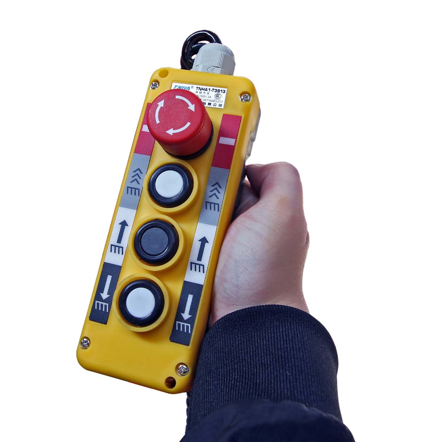 Handheld control panel with buttons and an emergency stop for operating a lift, showcasing user-friendly and safe controls for lifting equipment.