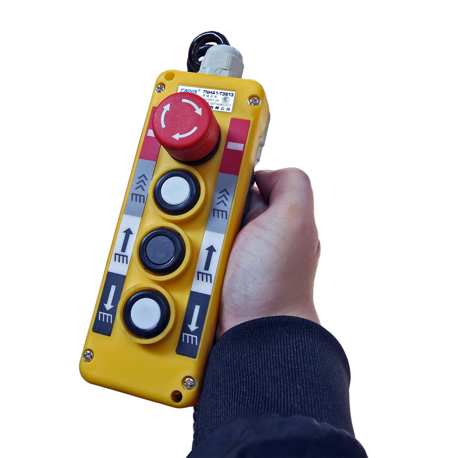 Handheld control panel with buttons and an emergency stop for operating a lift, showcasing user-friendly and safe controls for lifting equipment.