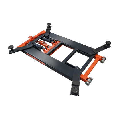 A top-down angle view of an orange and black EAE hydraulic scissor lift, model TS6600, in its fully lowered position. The structural framework and lifting mechanisms are clearly visible.