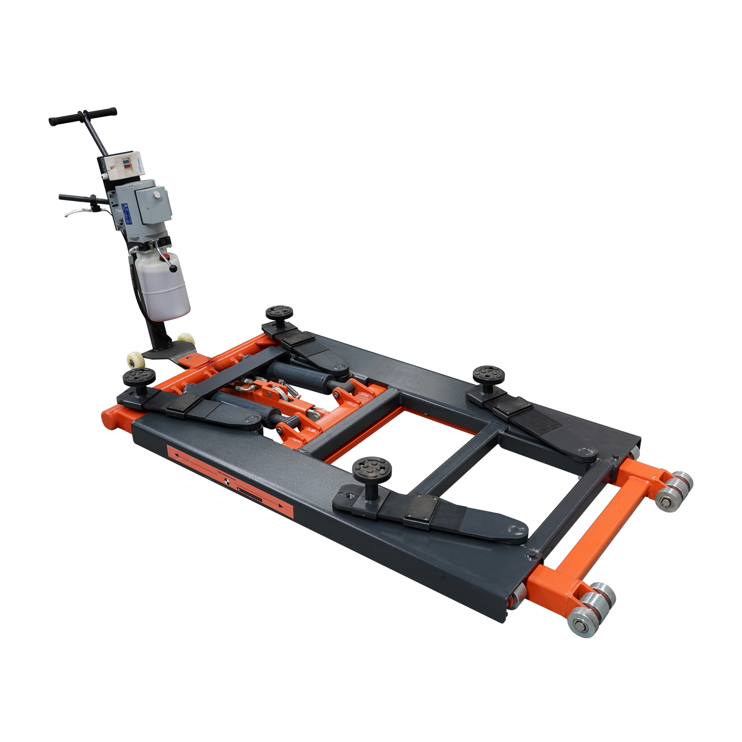 An orange and black EAE hydraulic scissor lift, model TS6600, in a fully lowered position on a workshop floor. The control unit with wiring is connected to the lift, showcasing its compact design. 