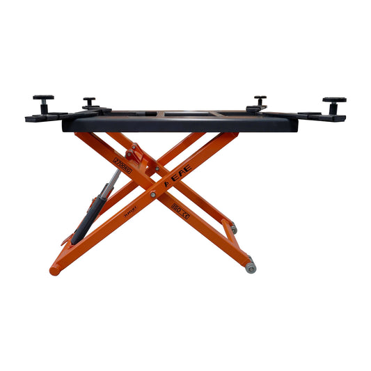 Side view of an orange hydraulic scissor lift platform by EAE. The 2700kg weight capacity, ISO and CE certifications visible on the frame