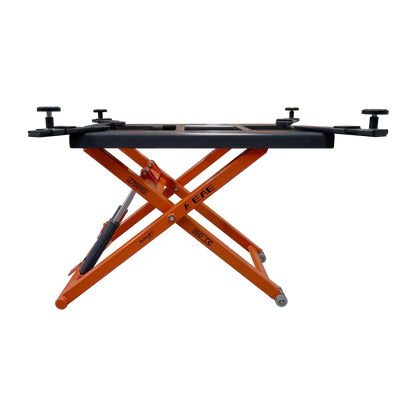 Side view of an orange hydraulic scissor lift platform by EAE. The 2700kg weight capacity, ISO and CE certifications visible on the frame