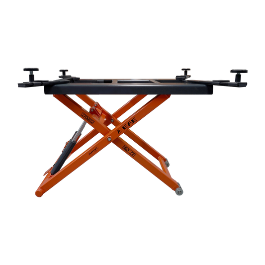 Side view of an orange hydraulic scissor lift platform by EAE. The 2700kg weight capacity, ISO and CE certifications visible on the frame