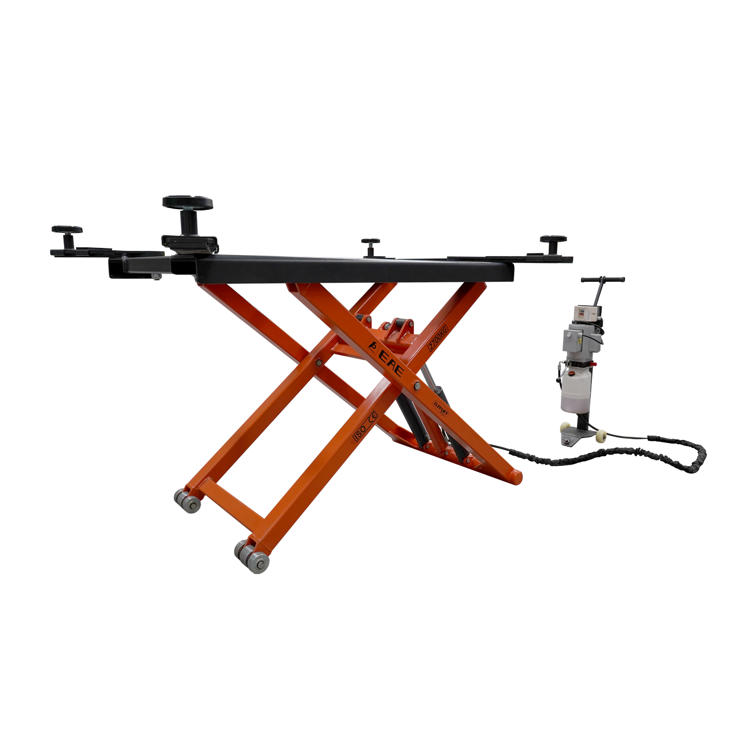 An orange EAE hydraulic scissor lift elevated at full height. The control unit and wiring are visible nearby, showcasing its compact design for vehicle maintenance.