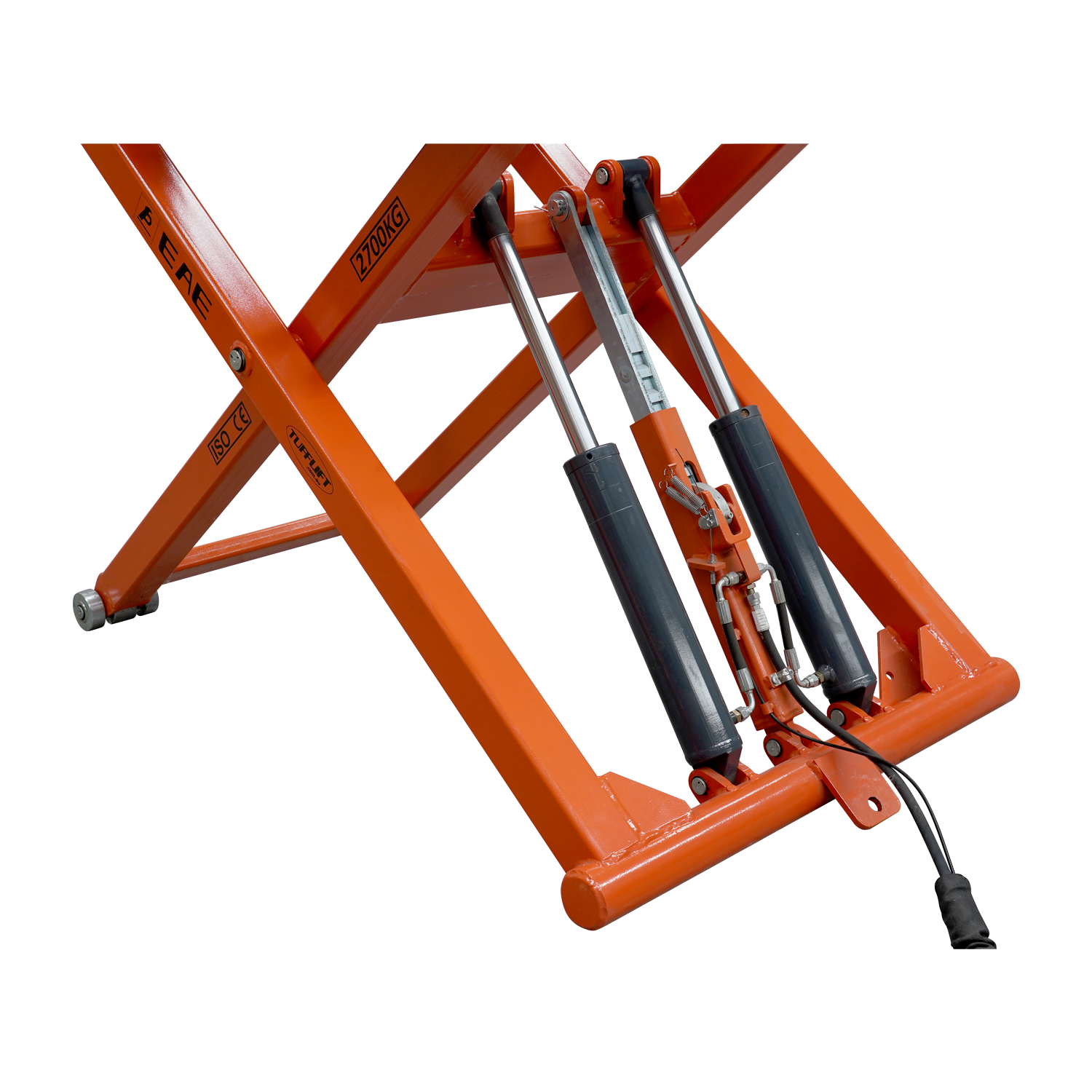 A close-up view of the hydraulic cylinders and mechanisms of an orange EAE scissor lift, model TS6600. The lift's support structure, labeled with a 2700kg capacity, is visible along with connected hydraulic lines and pistons.