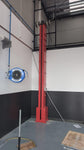 Red Mezzanine Tyre Elevator in a workshop environment
