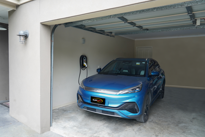 Zappi 7kw Untethered EV Charger mounted on a garage wall with a BYD electric car 