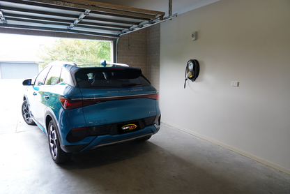 Zappi 7kw Untethered EV Charger mounted on a garage wall with a BYD electric car 