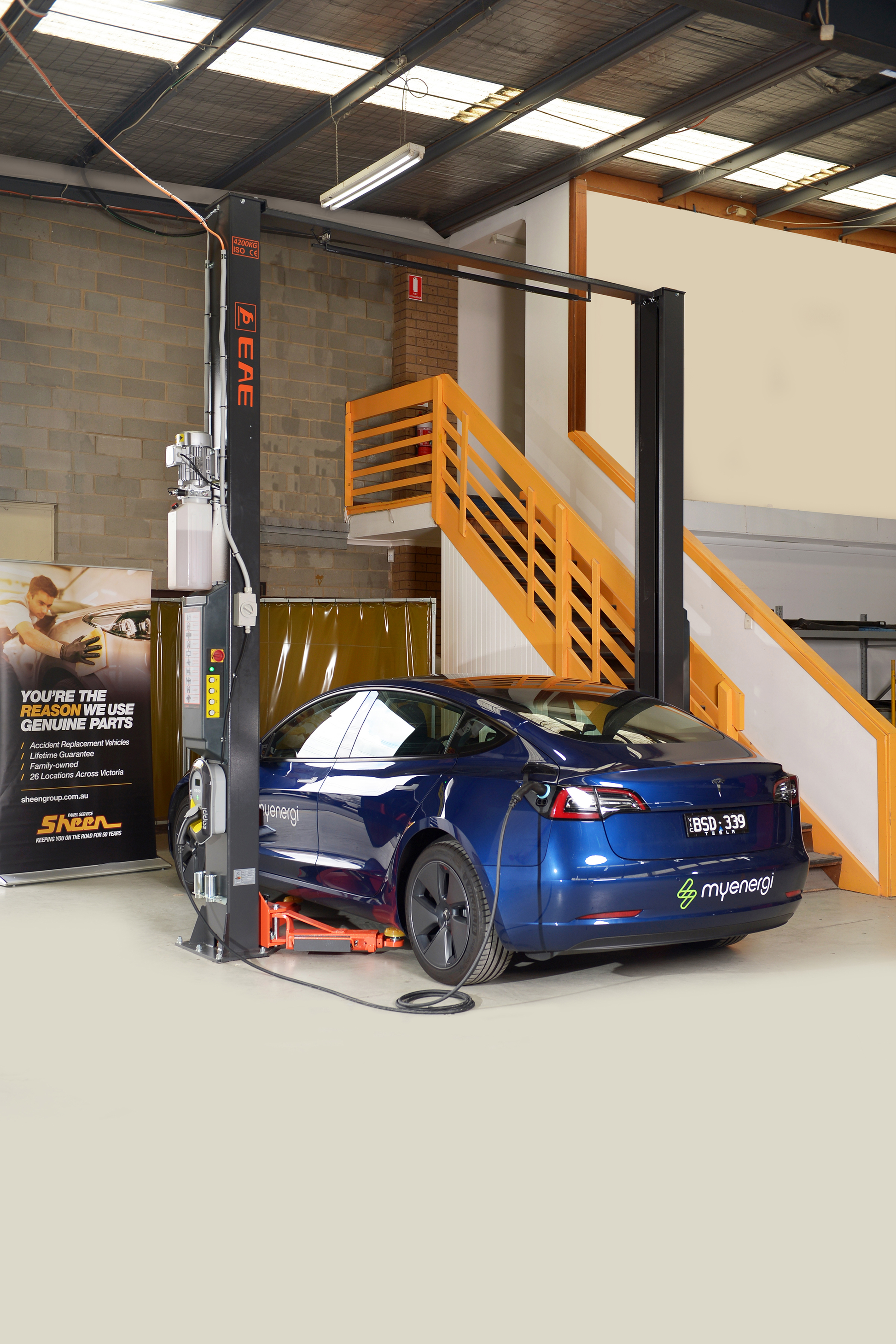 Zappi 7kw Untethered EV Charge Station mounted on a 2 post car hoist