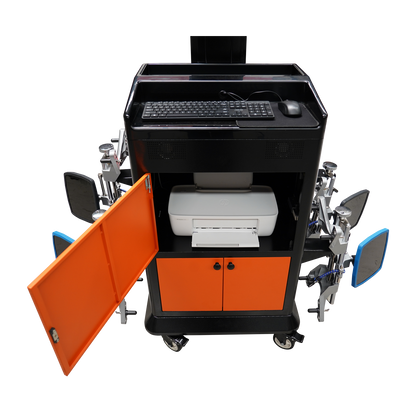 A focused top view of the Tufflift Powerlift wheel aligner, showing a keyboard, a printer in an open cabinet, and alignment clamps on both sides. 