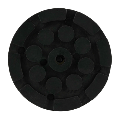 Font view of black circular hoist pad with a central hole and raised round sections, designed for use with car hoists to provide stability and grip.