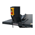 This image displays the control panel mounted on the motorcycle hoist. The yellow panel includes simple push-button controls for operating the lift, along with an emergency stop button for safety. The hoist has a maximum load capacity of 1500 lbs (682 kg), clearly labeled for reference.