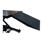 The image shows the loading ramp of the motorcycle hoist, made from diamond-patterned steel for enhanced traction. The ramp is securely attached to the platform, allowing easy motorcycle access to the lifting area.