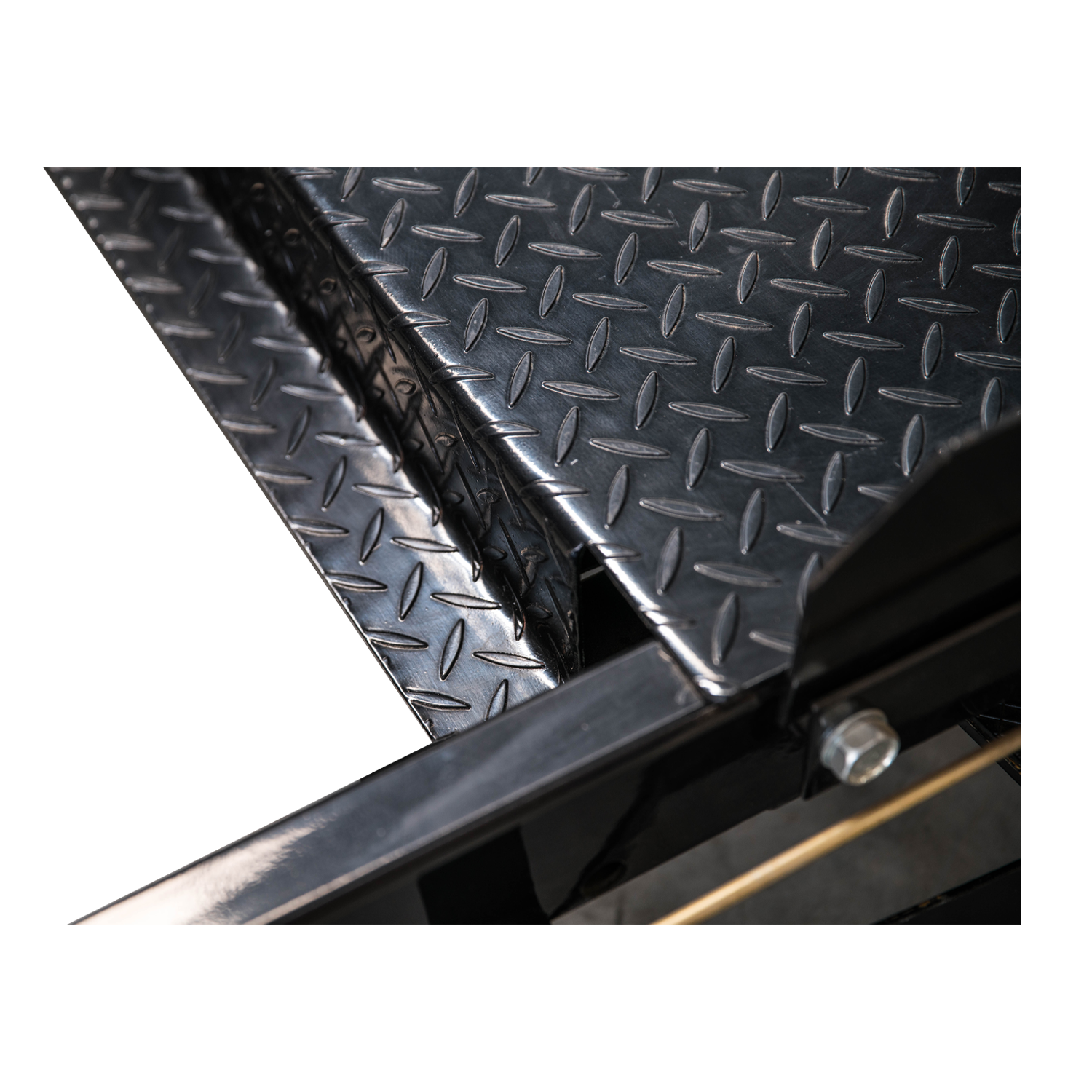 Detailed close-up of the TL3.6PH 4 post hoist’s diamond-plated surface, showcasing its durable, non-slip texture designed to ensure secure vehicle placement.