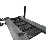 4 post hoist platform featuring drip trays, a steel tool tray, and rubber wheel chocks, designed to enhance vehicle maintenance by providing organized storage and spill protection.
