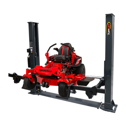 2 post car hoist with a durable dark grey frame, showcasing a Gravely mower lifted on the specialized arms, ideal for vehicle maintenance and repair tasks. - 2 Post Car Hoist Baseplate - 4 Ton - Turflift | TLG4.0BP