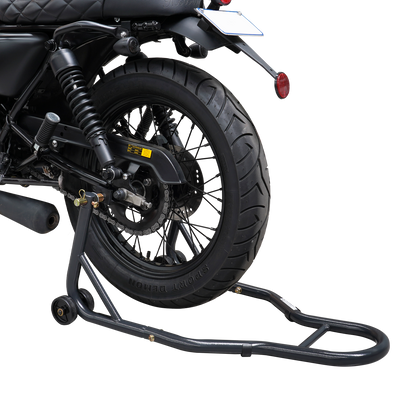 This image shows a rear wheel motorcycle stand supporting a bike from the back. The motorcycle's rear tire is lifted off the ground, allowing for maintenance, cleaning, or tire work. The stand features two support arms with wheels for easy positioning and balance, ensuring the motorcycle remains stable while elevated.